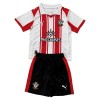 Virallinen pelipaita Southampton Koti 2025-26 Lyhythihainen - Lasten ( + Lyhyet housut ) Virallinen pelipaita Southampton Koti 2025-26 Lyhythihainen - Lasten ( + Lyhyet housut )